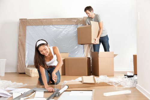 Professional office movers handling equipment