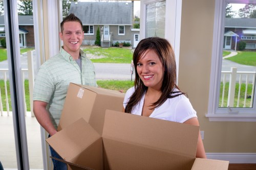 Professional movers handling furniture in Islington storage